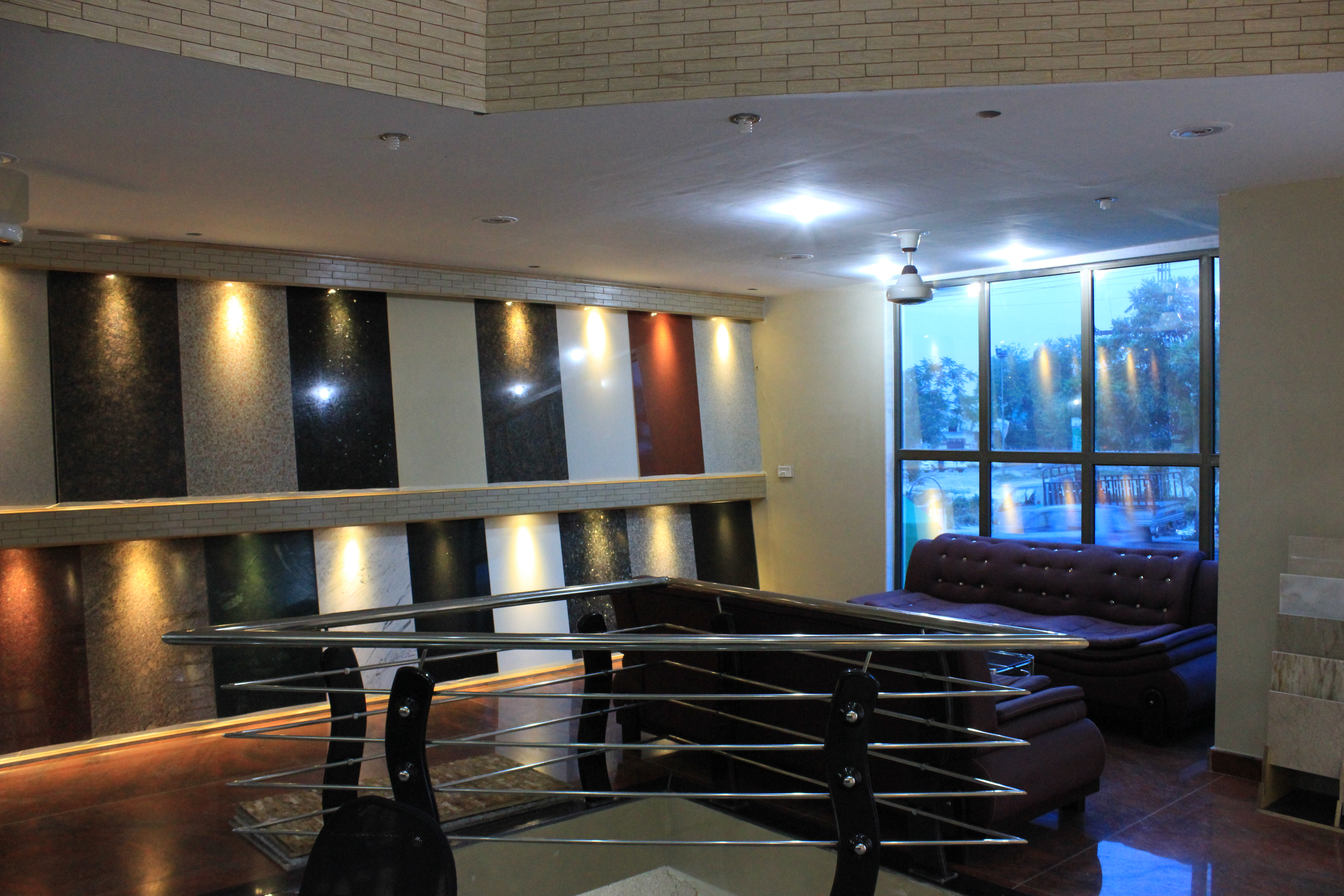 IGM stone showroom — illuminated stone sample display